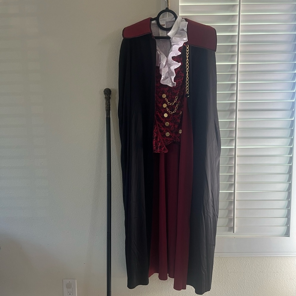 Men’s extra large vampire costume. Includes shirt/vest, cape, and staff